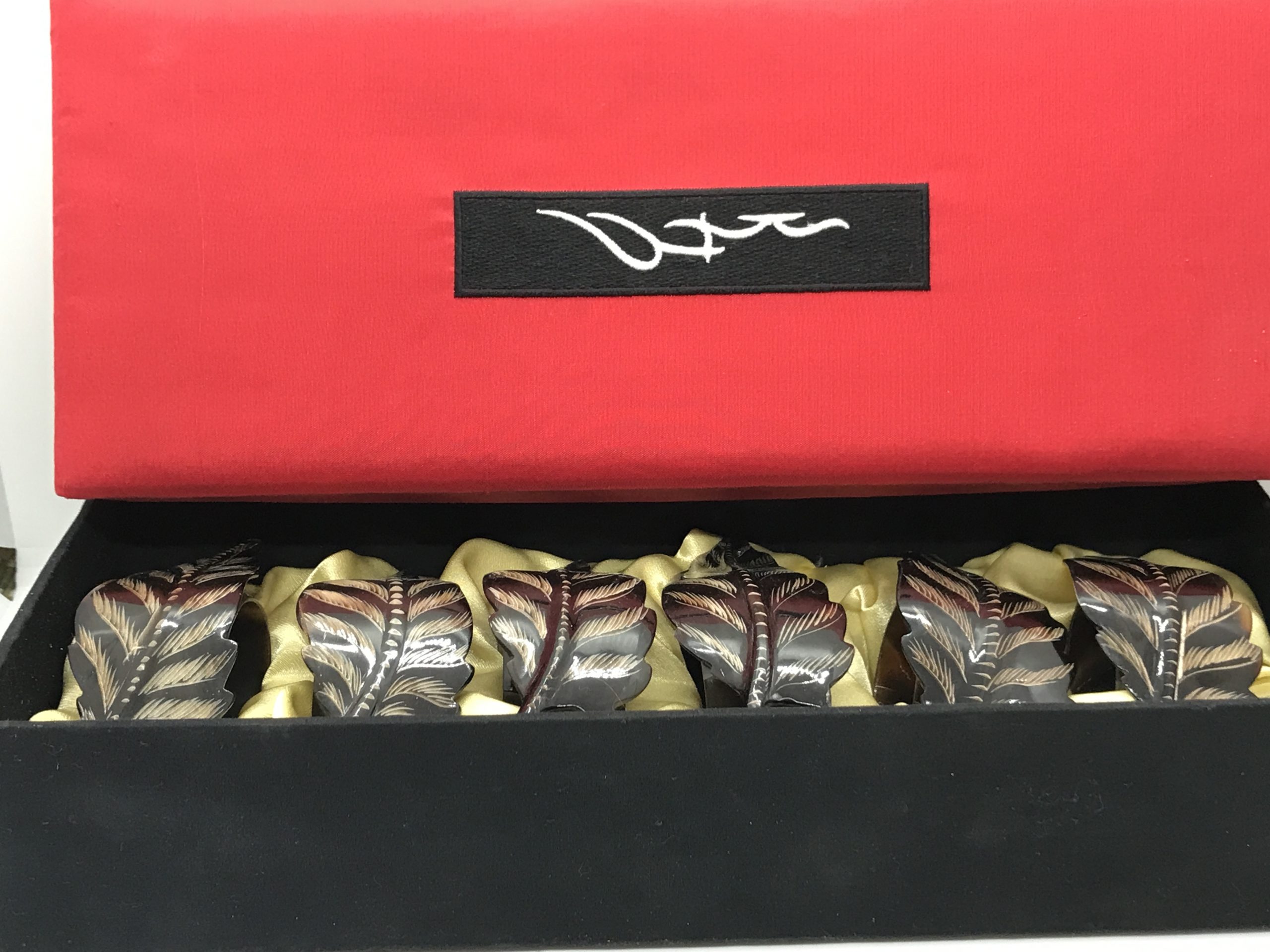 Set of 6 Cattle Horn Napkin Rings with Feather Overlay
