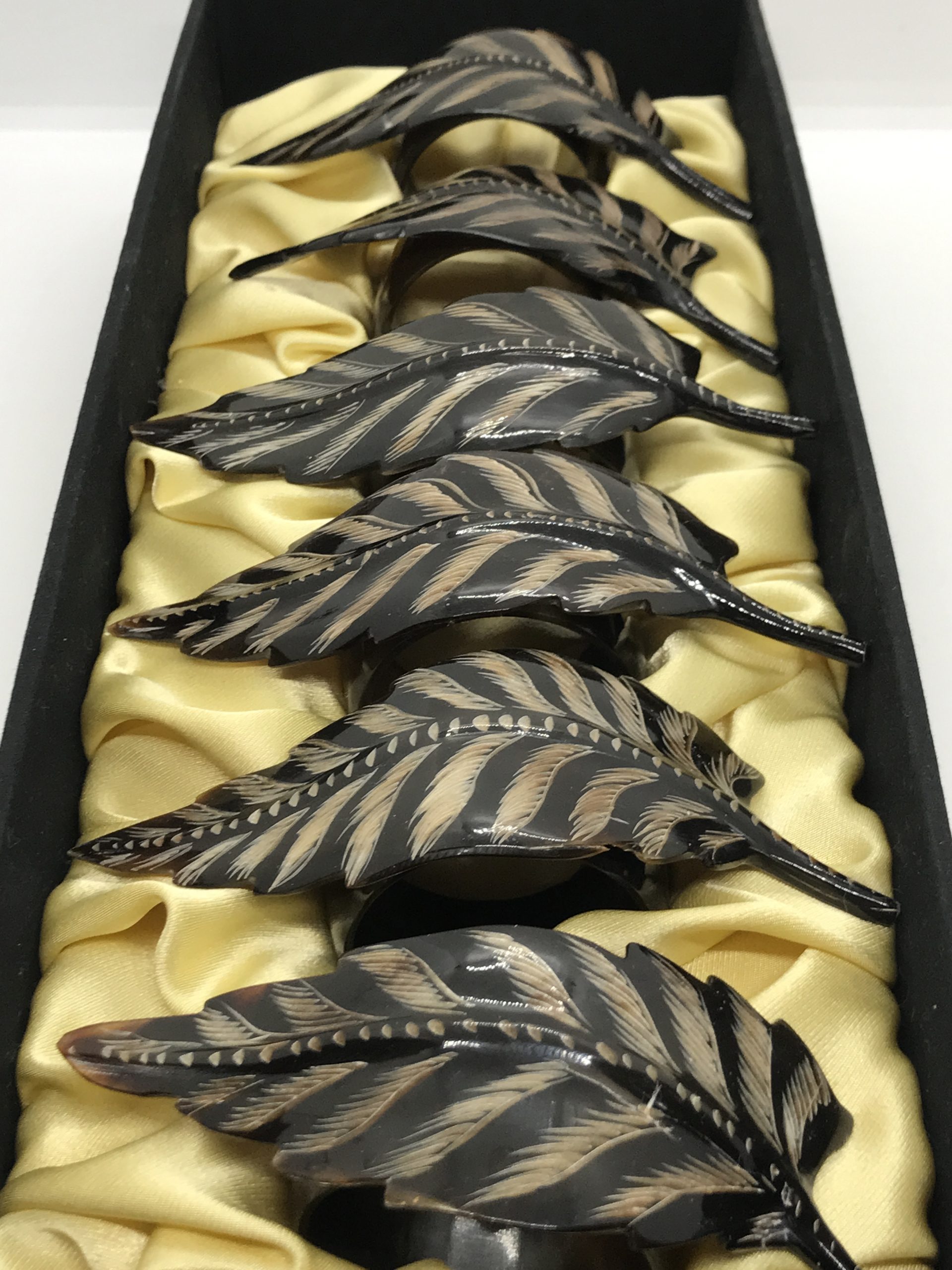 Set of 6 Cattle Horn Napkin Rings with Feather Overlay